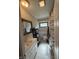 Clean bathroom with white tiling, a shower/tub, a window, and neutral tones throughout at 309 Arlington Dr, Whiteland, IN 46184