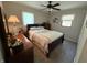 Comfortable bedroom with a full-sized bed, soft carpet, neutral paint and lots of natural light at 309 Arlington Dr, Whiteland, IN 46184