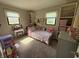Cheerful bedroom with bright decor, a vanity, a full bed, and natural lighting at 309 Arlington Dr, Whiteland, IN 46184