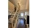 Inviting living room with hardwood flooring, neutral decor and stairs to the second floor at 309 Arlington Dr, Whiteland, IN 46184