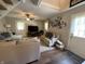 Inviting living room with hardwood flooring, neutral decor, a ceiling fan and comfortable seating at 309 Arlington Dr, Whiteland, IN 46184