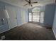Bedroom with carpeted floor, ceiling fan, and bright window at 3161 Compass Dr, Franklin, IN 46131