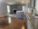 Open concept of the kitchen, living room, and dining area; modern decor and lots of natural light at 3161 Compass Dr, Franklin, IN 46131