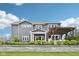 Landscaped backyard with pergola and retaining wall, perfect for outdoor enjoyment at 3316 Shelborne Woods Pkwy, Carmel, IN 46032