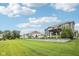 Large backyard with a retaining wall, pergola, green space, and landscaping at 3316 Shelborne Woods Pkwy, Carmel, IN 46032