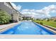 A beautiful backyard with a pool, hot tub, pergola, and green space at 3316 Shelborne Woods Pkwy, Carmel, IN 46032