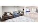 Finished basement includes workout equipment and seating area with comfortable leather recliners at 3316 Shelborne Woods Pkwy, Carmel, IN 46032