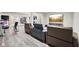 Finished basement includes workout equipment and seating area with comfortable leather recliners and large TV at 3316 Shelborne Woods Pkwy, Carmel, IN 46032