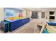 Finished basement space with bright play area including a ball pit, climbing wall and mini trampoline at 3316 Shelborne Woods Pkwy, Carmel, IN 46032