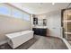 Spacious bathroom with a modern soaking tub, walk-in shower, and dual sink vanity at 3316 Shelborne Woods Pkwy, Carmel, IN 46032