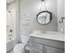 The bathroom boasts a modern vanity, decorative round mirror, and a tub/shower combo at 3316 Shelborne Woods Pkwy, Carmel, IN 46032