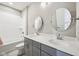 Well-lit bathroom features double sink, white subway tiles in shower/tub combo, and gray cabinets at 3316 Shelborne Woods Pkwy, Carmel, IN 46032