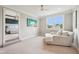 Comfortable bedroom with a plush chair, large window, and a TV offers a cozy and inviting space at 3316 Shelborne Woods Pkwy, Carmel, IN 46032