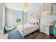 This vibrant bedroom features a playful mural, white furniture, and a cozy beanbag chair at 3316 Shelborne Woods Pkwy, Carmel, IN 46032