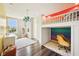 Colorful bedroom with hardwood floors, a loft bed, and decorative lighting at 3316 Shelborne Woods Pkwy, Carmel, IN 46032