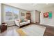 Sitting area with a white sofa, area rug, and hardwood floors at 3316 Shelborne Woods Pkwy, Carmel, IN 46032