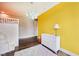Charming bedroom featuring colorful accents, hardwood floors, and ample natural light at 3316 Shelborne Woods Pkwy, Carmel, IN 46032