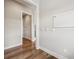 Bright entryway with hardwood floors, white trim, a whiteboard, and coat hooks provides stylish organization at 3316 Shelborne Woods Pkwy, Carmel, IN 46032