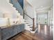 Staircase displaying stylish decor, hardwood floors, and a welcoming entrance at 3316 Shelborne Woods Pkwy, Carmel, IN 46032