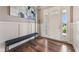 Elegant foyer featuring hardwood floors, a bench, and a bright entrance at 3316 Shelborne Woods Pkwy, Carmel, IN 46032