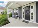 Inviting front porch with seating and a decorative wreath on the front door at 3316 Shelborne Woods Pkwy, Carmel, IN 46032