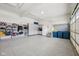 Clean garage with epoxy flooring, organized storage cabinets, and wall-mounted organizational racks at 3316 Shelborne Woods Pkwy, Carmel, IN 46032