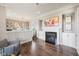 Inviting living room with fireplace, hardwood floors, and open to the dining area at 3316 Shelborne Woods Pkwy, Carmel, IN 46032