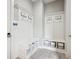 Organized mudroom with custom lockers, bench seating, and storage baskets offers convenient entry at 3316 Shelborne Woods Pkwy, Carmel, IN 46032