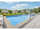 Backyard swimming pool with fountains and a seating area with lush green lawn at 3316 Shelborne Woods Pkwy, Carmel, IN 46032