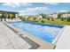 Backyard swimming pool and pergola with outdoor kitchen, in a neighborhood setting at 3316 Shelborne Woods Pkwy, Carmel, IN 46032