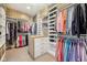 Large walk-in closet with built-in shelving and clothing racks at 3316 Shelborne Woods Pkwy, Carmel, IN 46032
