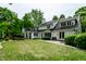 Backyard view featuring a patio and lush green lawn at 410 Somerset W Dr, Indianapolis, IN 46260