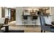 Open-concept floor plan with bar seating at 410 Somerset W Dr, Indianapolis, IN 46260