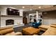 Finished basement with a fireplace, flatscreen tv, comfortable sofas and other chairs at 410 Somerset W Dr, Indianapolis, IN 46260