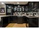 Basement bar with modern lighting and plentiful storage at 410 Somerset W Dr, Indianapolis, IN 46260
