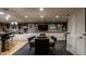Finished basement with an entertainment center with a bar and comfortable chairs at 410 Somerset W Dr, Indianapolis, IN 46260