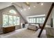 Spacious bedroom with large windows, vaulted ceiling, and cozy decor at 410 Somerset W Dr, Indianapolis, IN 46260