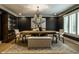 Elegant dining room with unique table, chandelier, and sophisticated decor at 410 Somerset W Dr, Indianapolis, IN 46260
