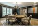 Spacious dining room with unique table and decorative lighting at 410 Somerset W Dr, Indianapolis, IN 46260