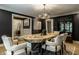 Beautiful dining room with hardwood floors, decor and ample seating at 410 Somerset W Dr, Indianapolis, IN 46260