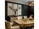 Close up of a dining room table with designer decor and chairs at 410 Somerset W Dr, Indianapolis, IN 46260