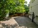 Home features a large driveway with access to the garage and backyard at 410 Somerset W Dr, Indianapolis, IN 46260