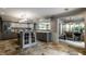 Open-concept kitchen showcasing tiled flooring and modern design elements at 410 Somerset W Dr, Indianapolis, IN 46260