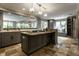 Spacious kitchen with granite countertops, stainless steel appliances, and a kitchen island at 410 Somerset W Dr, Indianapolis, IN 46260