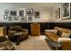 Contemporary living room featuring stylish furniture, unique artwork, and modern lighting at 410 Somerset W Dr, Indianapolis, IN 46260