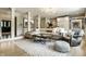 Bright, open living room featuring built-in cabinets, hardwood floors, and stylish furnishings at 410 Somerset W Dr, Indianapolis, IN 46260
