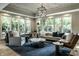 Bright living room featuring large windows and neutral tones and sophisticated decor at 410 Somerset W Dr, Indianapolis, IN 46260