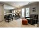 Living room with a large mirror, comfortable seating, and a walkout to the patio at 410 Somerset W Dr, Indianapolis, IN 46260