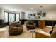 Modern living room featuring stylish furniture, black and white wall art, and hardwood floors at 410 Somerset W Dr, Indianapolis, IN 46260