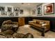Well-designed living room with unique furniture, attractive artwork, and modern lighting at 410 Somerset W Dr, Indianapolis, IN 46260